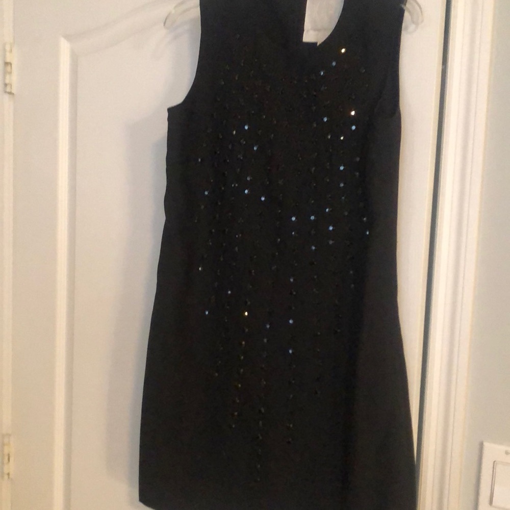Black Karta dress with Detail black studs in the front.